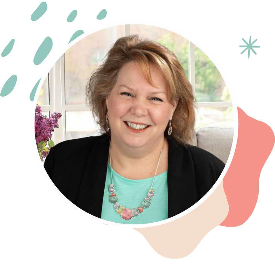 Alina Eastman smiling in a black blazer, casual indoor portrait in circular frame